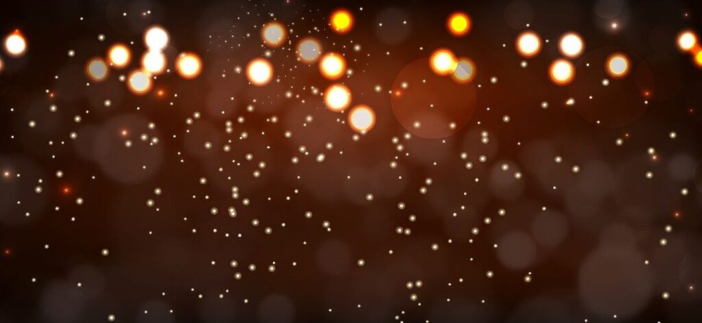 Glowing lights out of focus on a dark background