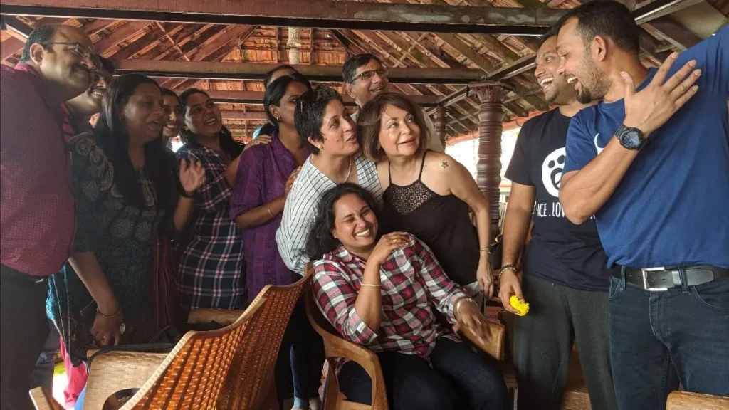 A group of people cheering and smiling